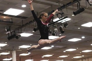 Cece Belady competes on the beam