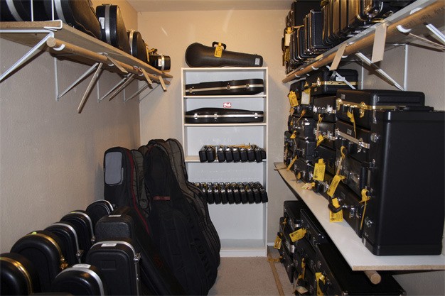 Instruments line the storage area at Mercer Island Music
