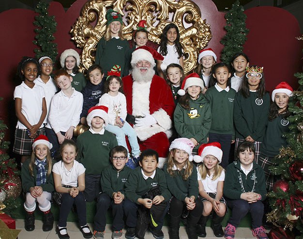 The St. Monica elementary school choir students had a visit with Santa after a recent tour of caroling. The students sing Christmas carols for the residents at Sunrise Retirement Home on Mercer Island.