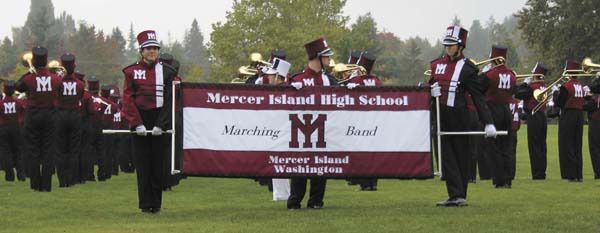 The MIHS marching band practices prior to the MIHS homecoming parade on Friday