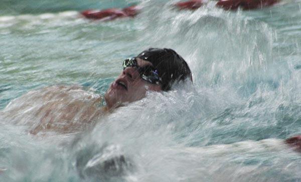 Michael Bower completes his first lap of the boys 200-meter individual medley relay race during the Islanders meet against Interlake last Thursday.