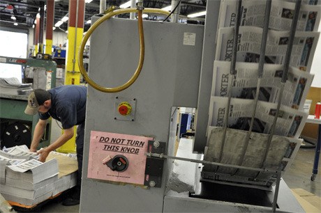 Copies of the Mercer Island Reporter head to the labeler at the Sound Publishing Everett Press. The paper is printed on Tuesday mornings and delivered to readers on Wednesday.
