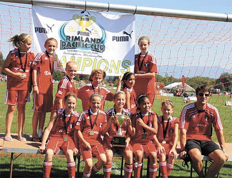 The local Eastside Football Club Girls U11 team were the Champions of the Puma Rimland Pacific Cup soccer tournament. The team includes: (back row) Victoria Wheeler