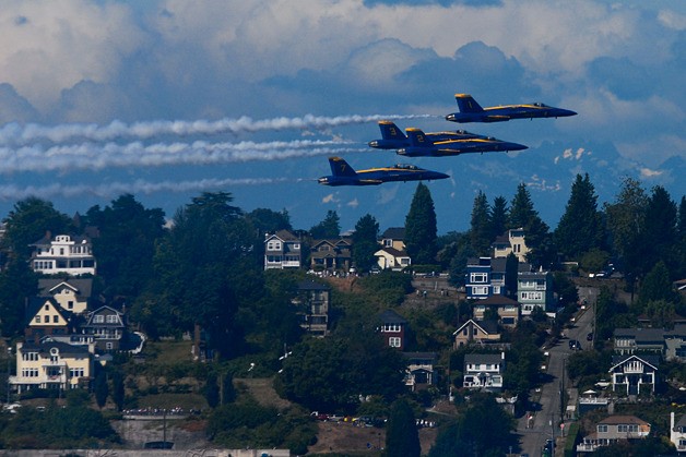 The U.S. Navy Blue Angels take to the air over Lake Washington during a Seafair airshow practice session in this view from Mercer Island on Thursday morning.