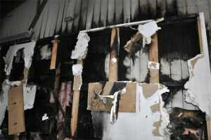 A fire burned through the wall of a home in the 3400 block of 80th Avenue S.E. on Wednesday