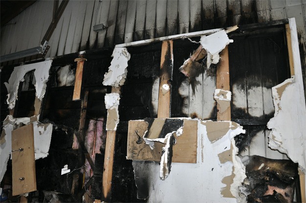 A fire burned through the wall of a home in the 3400 block of 80th Avenue S.E. on Wednesday