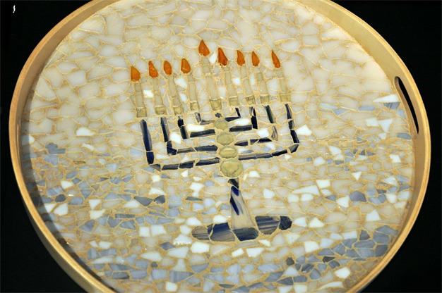 A finely done glass mosaic by Marcella Diamond features a menorah as part of the Mercer Island Visual Arts League holiday display at the Mercer Island Community and Event Center.