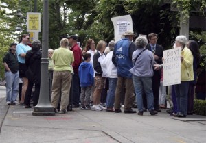Eighth District constituents gather outside of U.S. Rep. Dave Reichert's office on Mercer Island