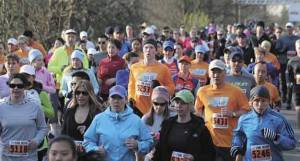 Runners in the Rotary Run 10k take off after the start on Sunday morning. A record number of runners turned out for the 40th anniversary.