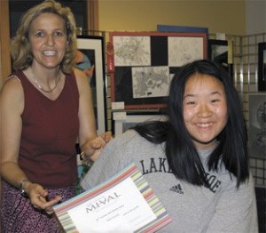 Grace Thomas earns her award certificate from  Doris Kleemann-Fischer