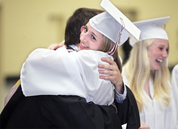 Rachel Bowdle hugs MIHS band director Parker Bixby