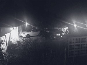 Police talk to suspects after a car crash at the corner of 72nd Avenue S.E. and S.E. 24th Street.