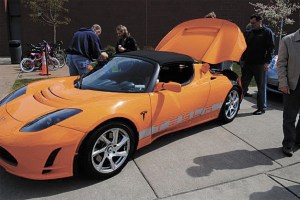 Islanders Jason King and Lance Merkin got a Tesla sports car for the city’s Leap for Green fair. The all-electric roadster was on display all day.