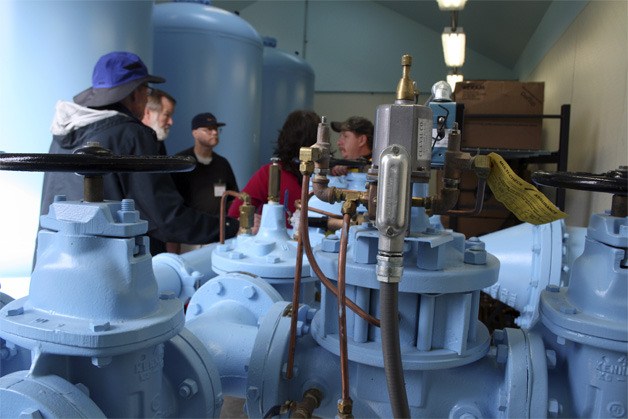 Islanders listen as Mercer Island city maintenance employee Eric Moltz