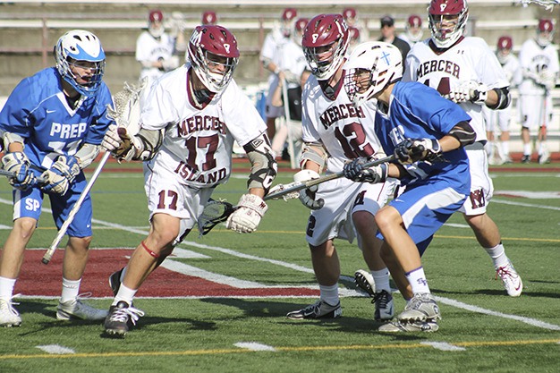 Mercer Island’s Evan Condon maneuvers through the Seattle Prep defense Tuesday