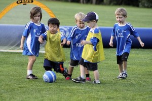 Kids on Keiko Stafford’s Lil’ Kickers team jostle for the ball at Homestead Field on Friday
