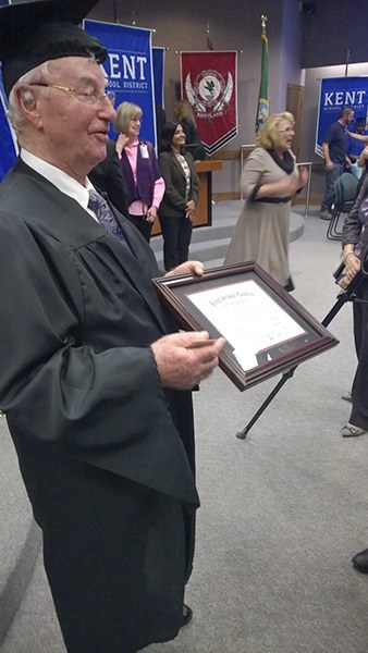 Islander Henry Friedman shows off his new high school diploma from the Kent School District at a special graduation ceremony held earlier this month.