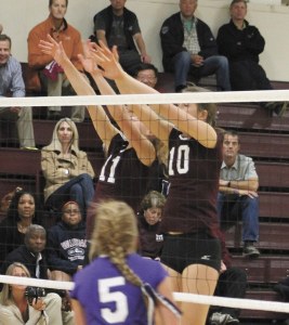 Mercer Island's Lottie MacAulay (10) and Kris Brackmann (11) just miss a block during the Islanders 3-0 win over Lake Washington on Tuesday