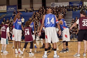 Mercer Island High School English teacher Jan Sayers (14) tries to stay open for a pass during a game against retired members of the Harlem Globetrotters.