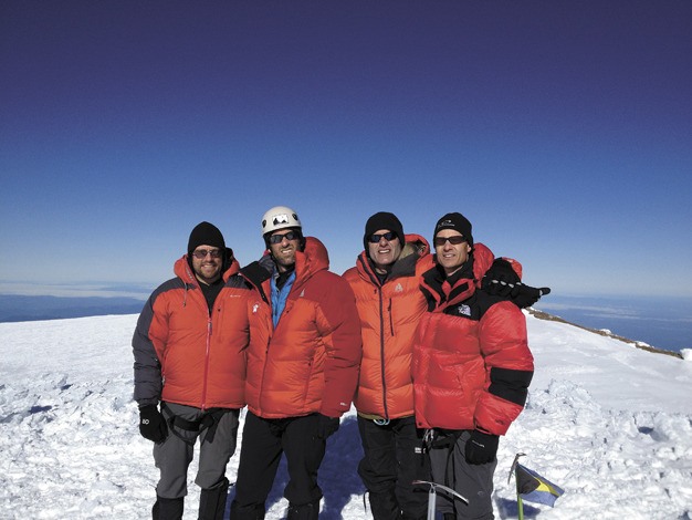 Standing atop Mt. Rainier on June 20 are 40-ish Mercer Island dads from right
