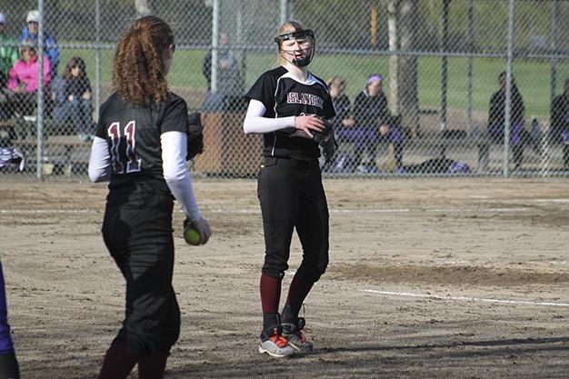 Mercer Island's Morgan Peyou delivers the ball to first base Friday