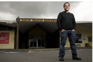 YTN executive director Manuel Cawaling stands in front of the theatre.