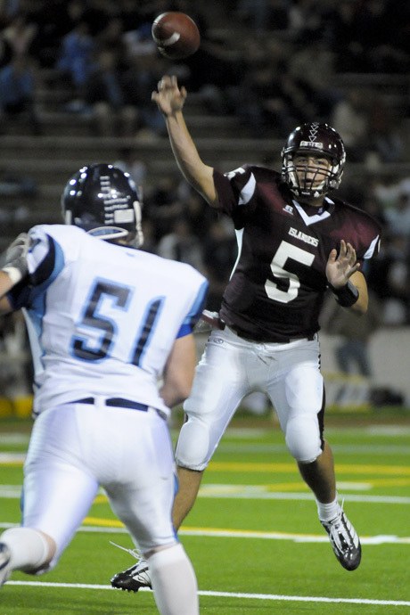 Islander quarterback Jeff Lindquist (5) passes against Interlake at Mercer Island on Friday. Interlake won a 51-45 shootout at Islander Stadium.