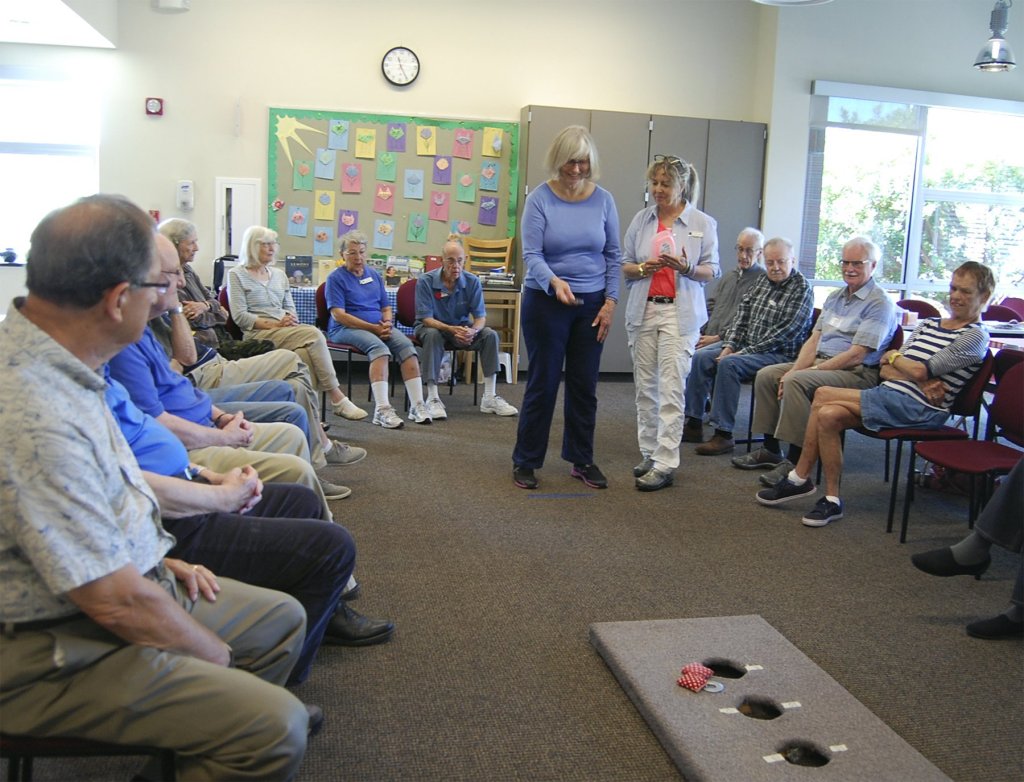 Participants and volunteers in Mercer Island's Senior Social program play a Cornhole-like game at the Aug. 23 meeting. The group meets from 10 a.m. to 2 p.m. Tuesday through Thursday at the Community and Event Center. Katie Metzger/staff photo