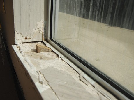 A corroded window sill in the Islander Middle School gym sits waiting for repair on May 7.