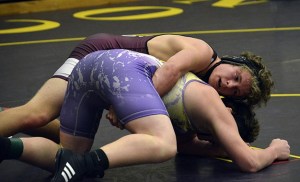 Mercer Island freshman Donnie Howard (top) wrestled his way to a third-place finish at the boys wrestling 3A Regional Tournament Saturday