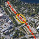 This aerial view of the stretch of I-90 by Mercer Island&rsquo;s Town Center shows the light rail alignment (dotted line) and planned station area (circled). Photo courtesy of the city of Mercer Island