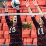 Tessa Fisk blocks a Mt. Spokane shot, assisted by Lindsey Lovsted. Photo courtesy of John Fisk.