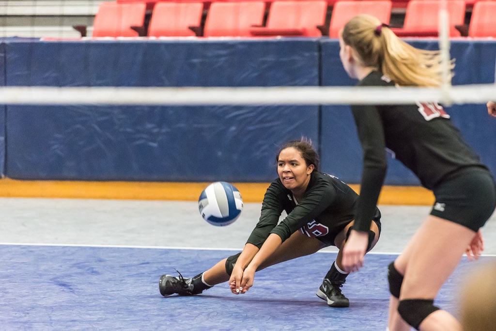 Adara Hamilton crouches low for the defensive save. Photo courtesy of John Fisk.