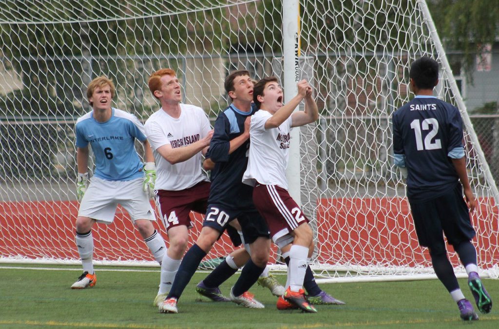 Mercer Island&rsquo;s Austin Taylor (14) and Mitchell Meade (2) fight for position on a first-half corner kick during the 3A boys soccer state championship in Puyallup. File photo.