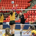 Mercer Island&rsquo;s Natalie Robinson, the 2016 KingCo 3A MVP, sends a shot over the outstretched arms of Capital High&rsquo;s front line. File photo.