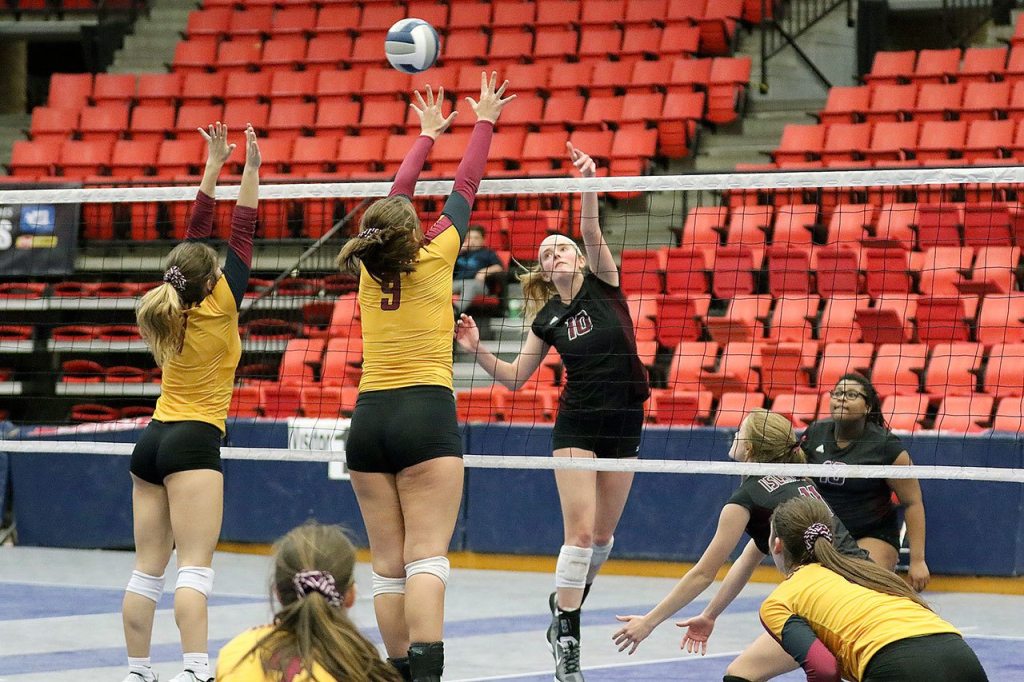 Mercer Island&rsquo;s Natalie Robinson, the 2016 KingCo 3A MVP, sends a shot over the outstretched arms of Capital High&rsquo;s front line. File photo.
