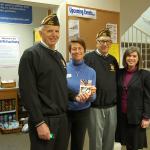 Bob Harper and Dean Quigley of the VFW pose with Cindy Goodwin and Sari Weiss of the city of Mercer Island&rsquo;s Youth and Family Services (YFS) Department.