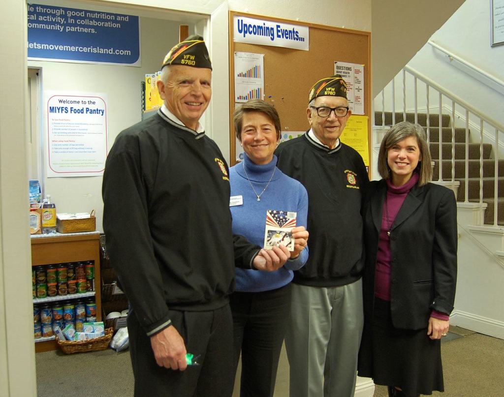 Bob Harper and Dean Quigley of the VFW pose with Cindy Goodwin and Sari Weiss of the city of Mercer Island&rsquo;s Youth and Family Services (YFS) Department.