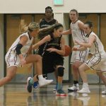 Mercer Island&rsquo;s Macy Mounger, far left, and Claire Mansfield, far right, swarm Sammamish guard Katelyn Nagel during the Islanders&rsquo; home opener against the Totems Friday at Mercer Island High School. Mercer Island beat Sammamish 69-33. Joe Livarchik/staff photo.