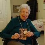 Covenant Shores resident Lois Dusenbery holds a photo of herself taken at Hickam Field, the Air Force base that borders Pearl Harbor. Dusenberry witnessed the attack on Pearl Harbor 75 years ago. Katie Metzger/staff photo