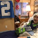 100-year-old Lois Lawson got a signed Seahawks flag for her birthday. Photos courtesy of Greg Asimakoupoulos