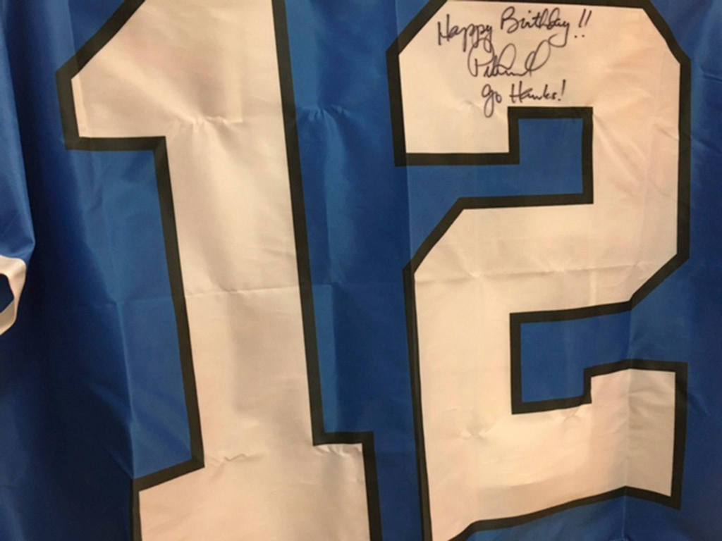 Longtime Seahawks fan in Mercer Island gets present from Pete Carroll