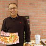 Jish Nath holds a tandoori chicken pizza, one of the dishes on both his Indian and Italian menus at Dalhousie Square and Roberto&rsquo;s. Katie Metzger/staff photo