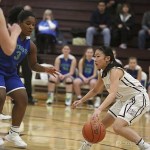 Photo courtesy of Don Borin/Stop Action Photography                                Mercer Island senior point guard Kailee Yan, right, makes a move against Liberty defender Jasmine Baker, left, in a matchup between KingCo squads on Jan. 4 in Mercer Island. The Islanders defeated the Patriots 64-29.