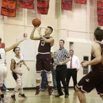 Photo courtesy of Don Borin/Stop Action Photography                                Mercer Island junior guard William Lee, center, puts up a short jump shot against the Sammamish Totems. The Islanders defeated the Totems 75-48 on Jan. 10 at Sammamish High School in Bellevue.