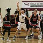 Mercer Island&rsquo;s Ethan Eason (11) defends Ballard&rsquo;s Fresh Ausar (2) Saturday night at Mercer Island High School. The Beavers beat the Islanders 41-37 to end Mercer Island&rsquo;s season (Joe Livarchik/staff photo).