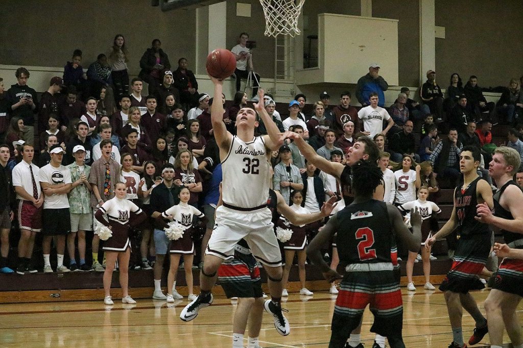 Mercer Island&rsquo;s Griffin Emanuels goes up for the lay-in against Ballard (Joe Livarchik/staff photo).