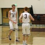 Mercer Island&rsquo;s Joe Gormley (10) celebrates with teammate Jack Delay (3) after a big shot (Joe Livarchik/staff photo).