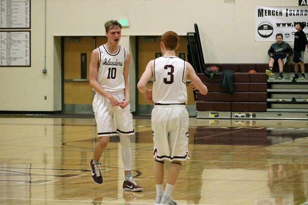Mercer Island&rsquo;s Joe Gormley (10) celebrates with teammate Jack Delay (3) after a big shot (Joe Livarchik/staff photo).