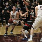 Mercer Island&rsquo;s Griffin Emanuels fights his way into the paint against Ballard on Feb. 11 at Mercer Island High School. Emanuels was recently named KingCo 2A/3A Defensive MVP (Joe Livarchik/staff photo).